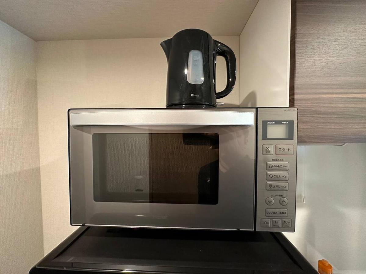 Appartement 上野駅徒歩５分シングルベッド４台+ソファベッド２台 1ldk *